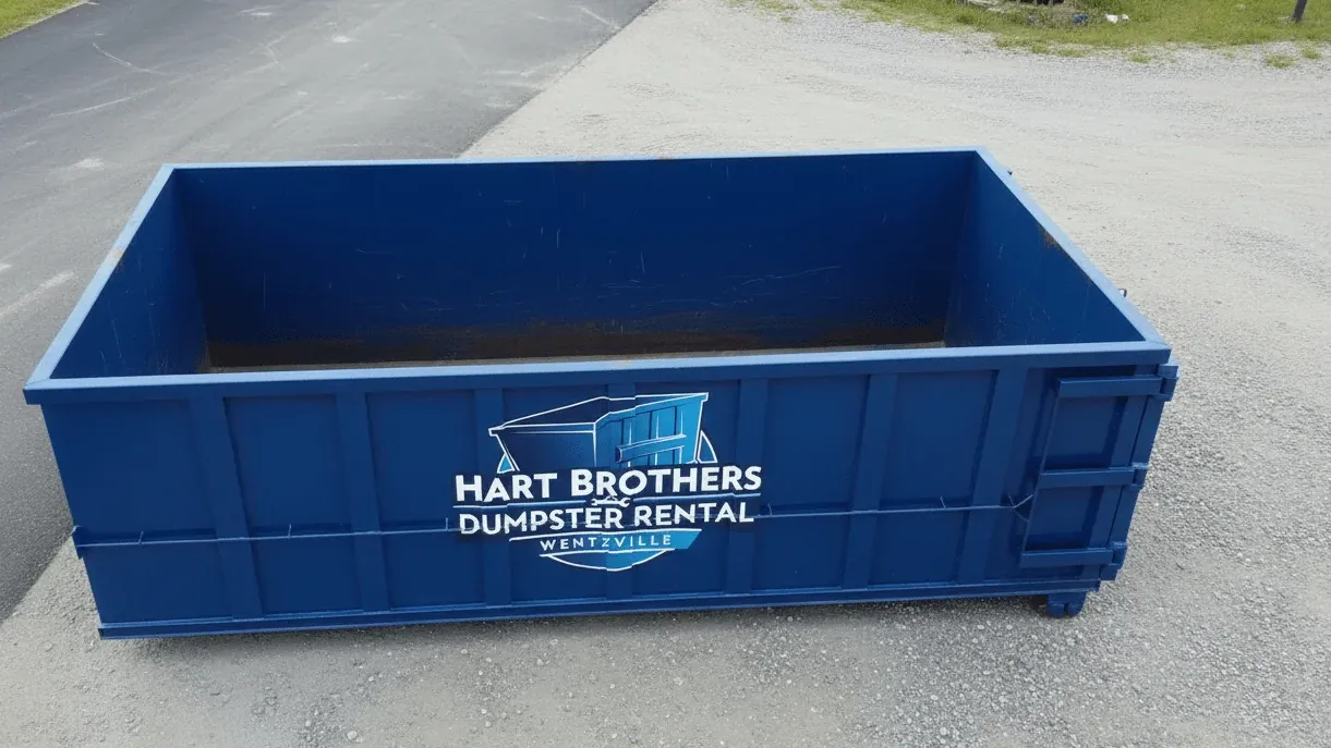 Basement finishing and cleanout debris in Wentzville — container outside a full-basement subdivision home